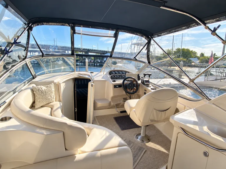 Cockpit of the 30-foot cruiser with helm seat and curved lounge seating