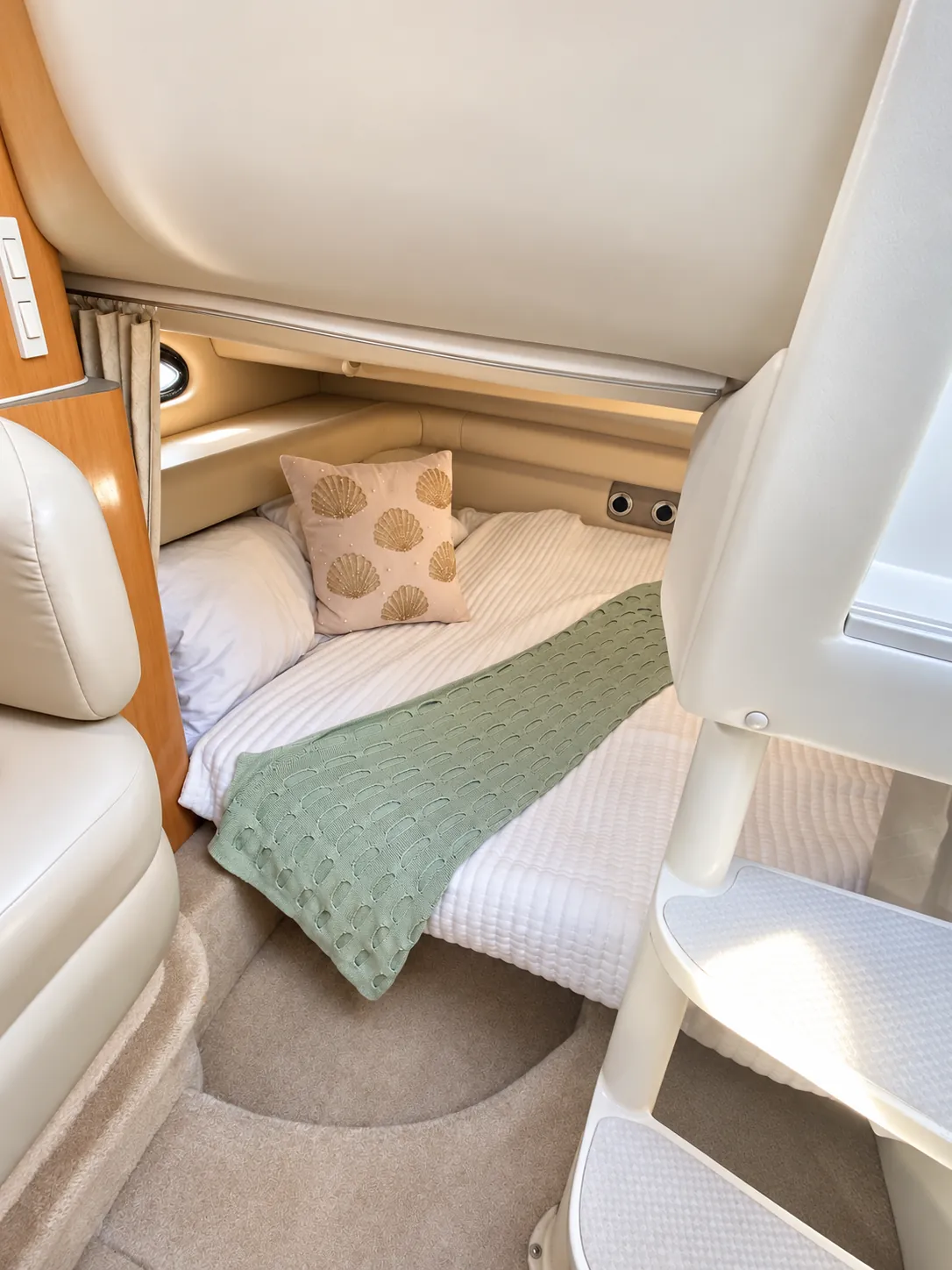 Mid-cabin berth with bedding inside the 30-foot cruiser