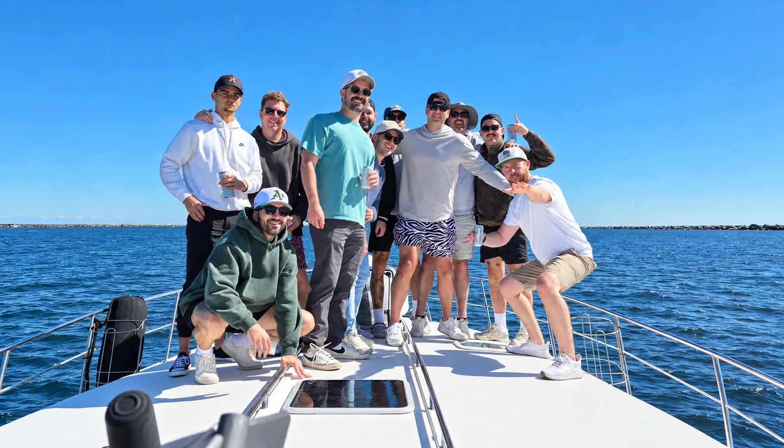 Group of friends posing on the bow of the 44-foot Sea Ray during a Jacksonville yacht charter