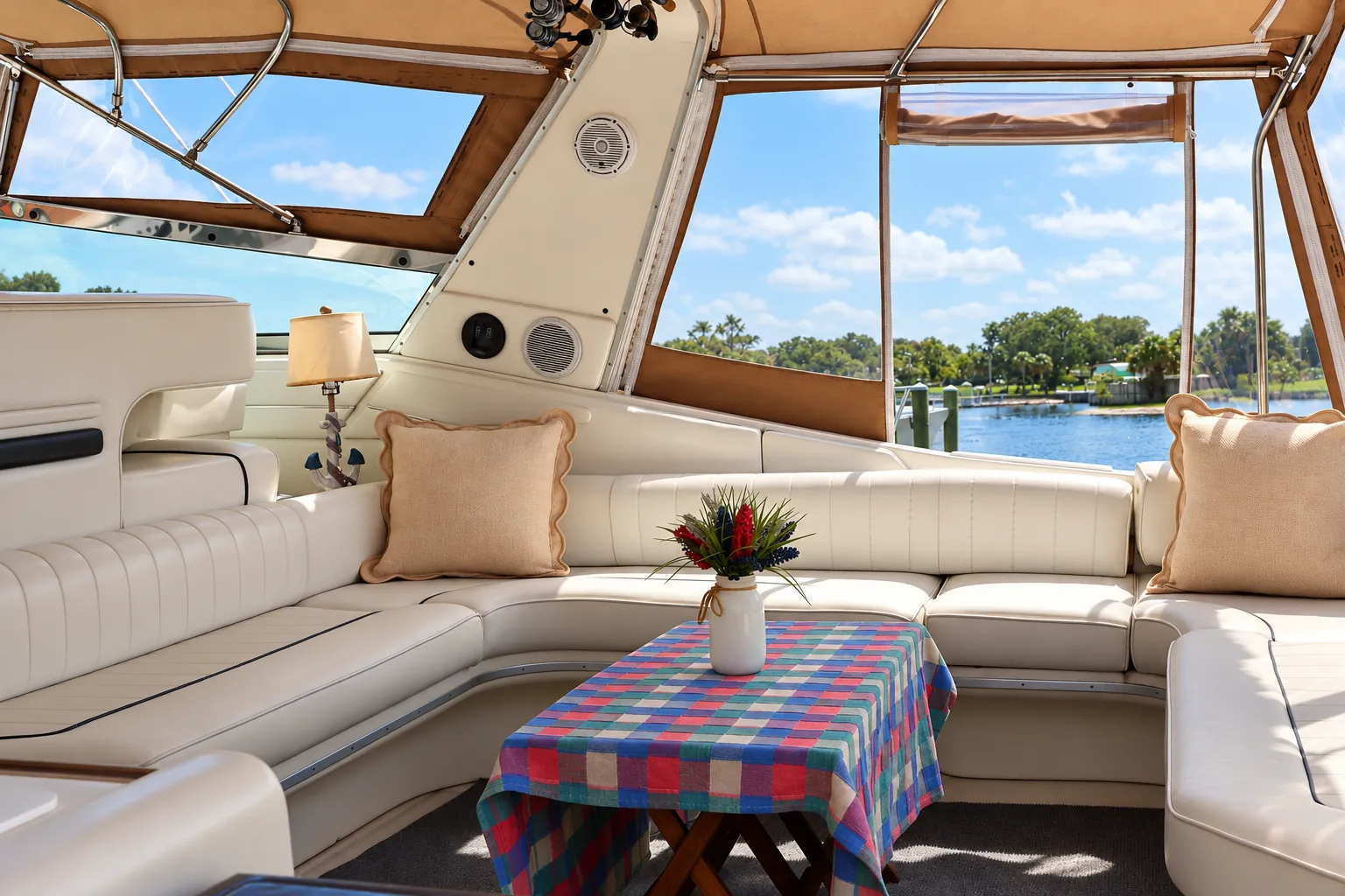 Wraparound cockpit lounge seating under the canopy of the 44-foot Sea Ray yacht