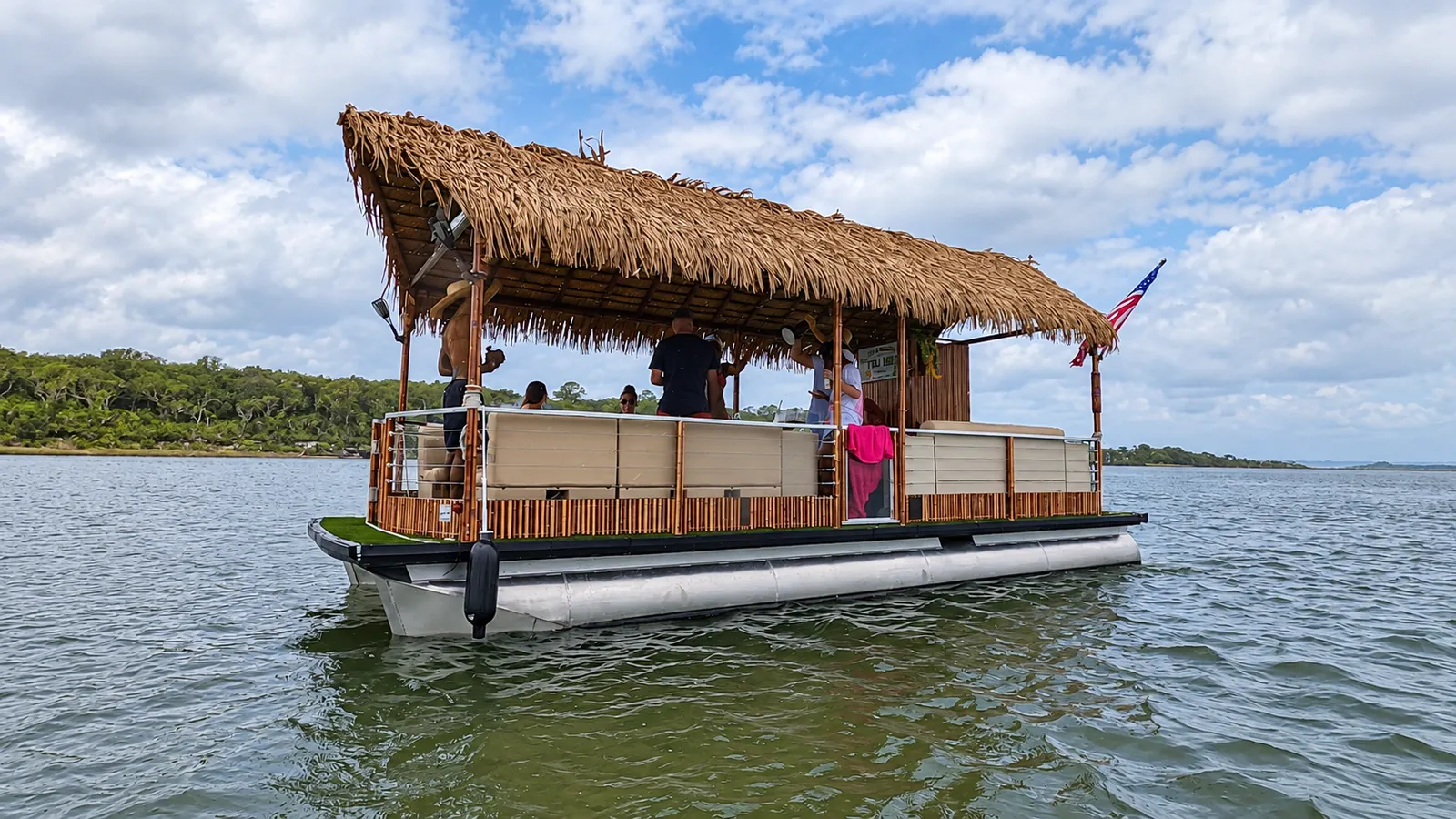 Tiki hut pontoon boat out on the water near Jacksonville